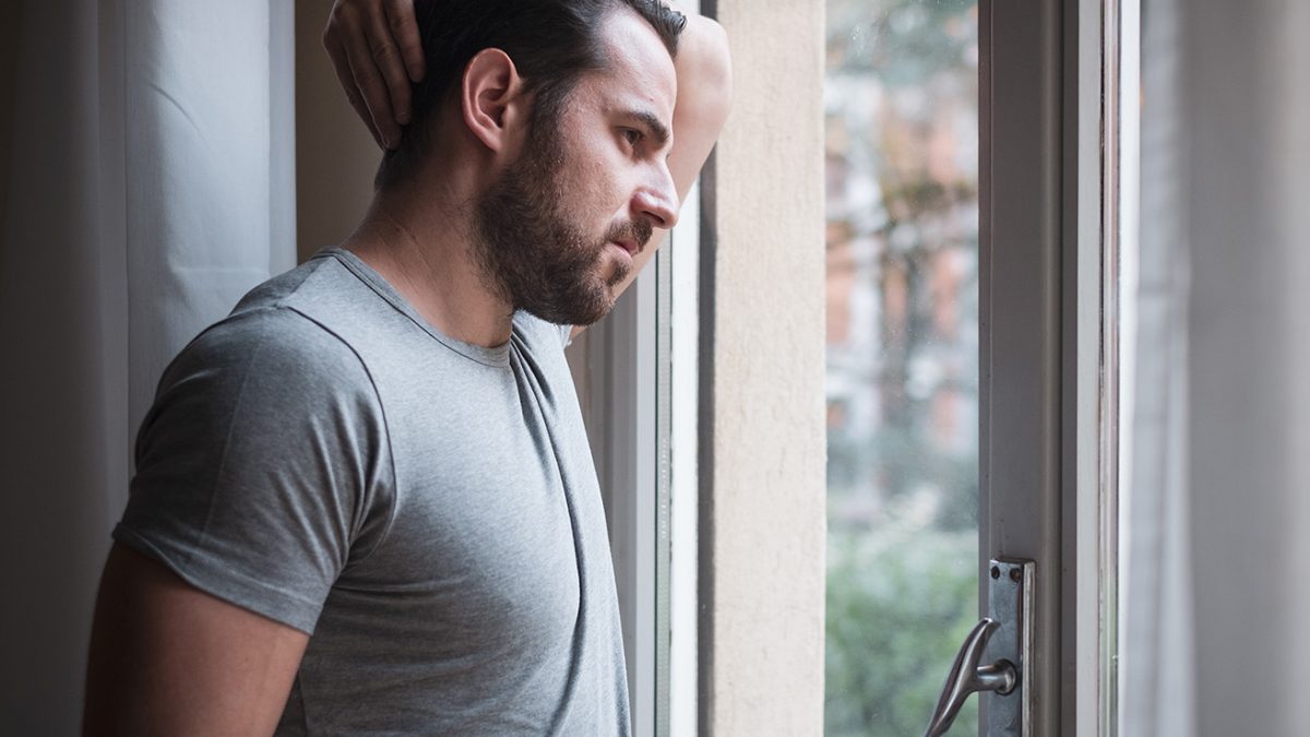 depressed man dealing with drug cravings